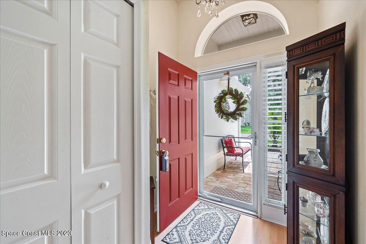 2190 Spring Creek Circle Palm Bay, FL 32905 - Photo 4 of 73 a view of a hallway to a livingroom with furniture and front door