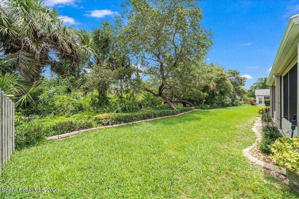 2190 Spring Creek Circle Palm Bay, FL 32905 - Photo 41 of 73 a view of a garden with an outdoor space