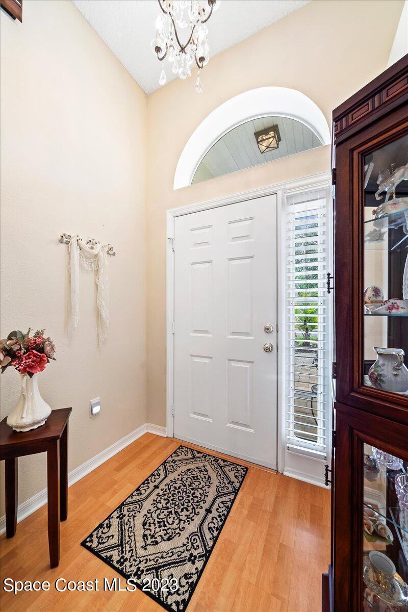 2190 Spring Creek Circle Palm Bay, FL 32905 - Photo 5 of 73 a view of a hallway to a livingroom with furniture