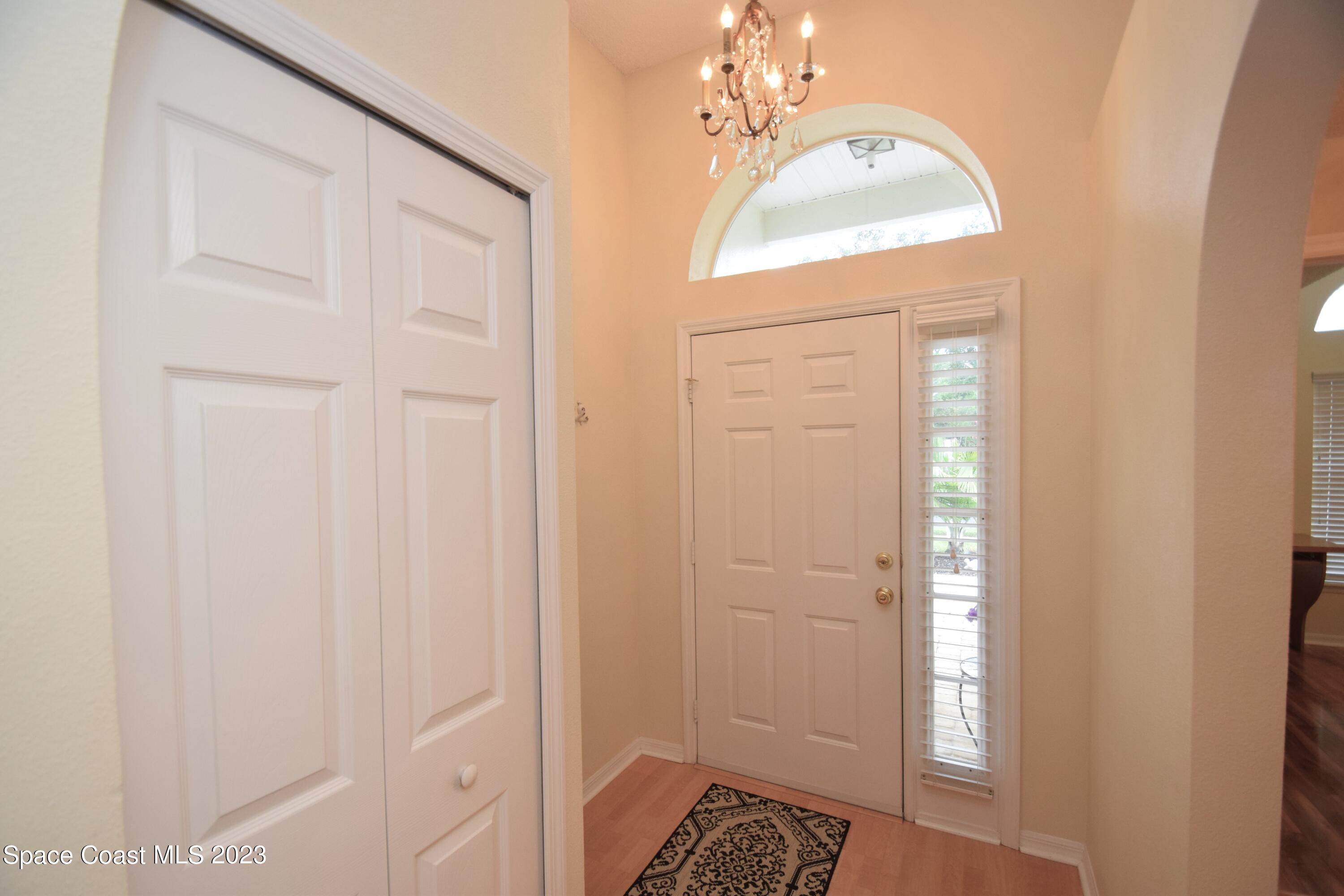 2190 Spring Creek Circle Palm Bay, FL 32905 - Photo 51 of 73 a view of a bathroom with a sink and mirror