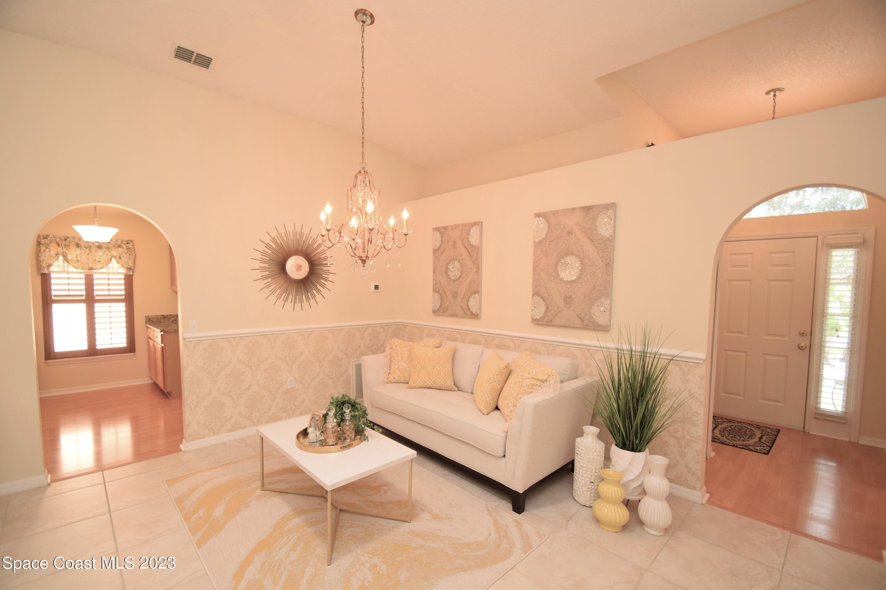 2190 Spring Creek Circle Palm Bay, FL 32905 - Photo 60 of 73 a living room with furniture and wooden floor