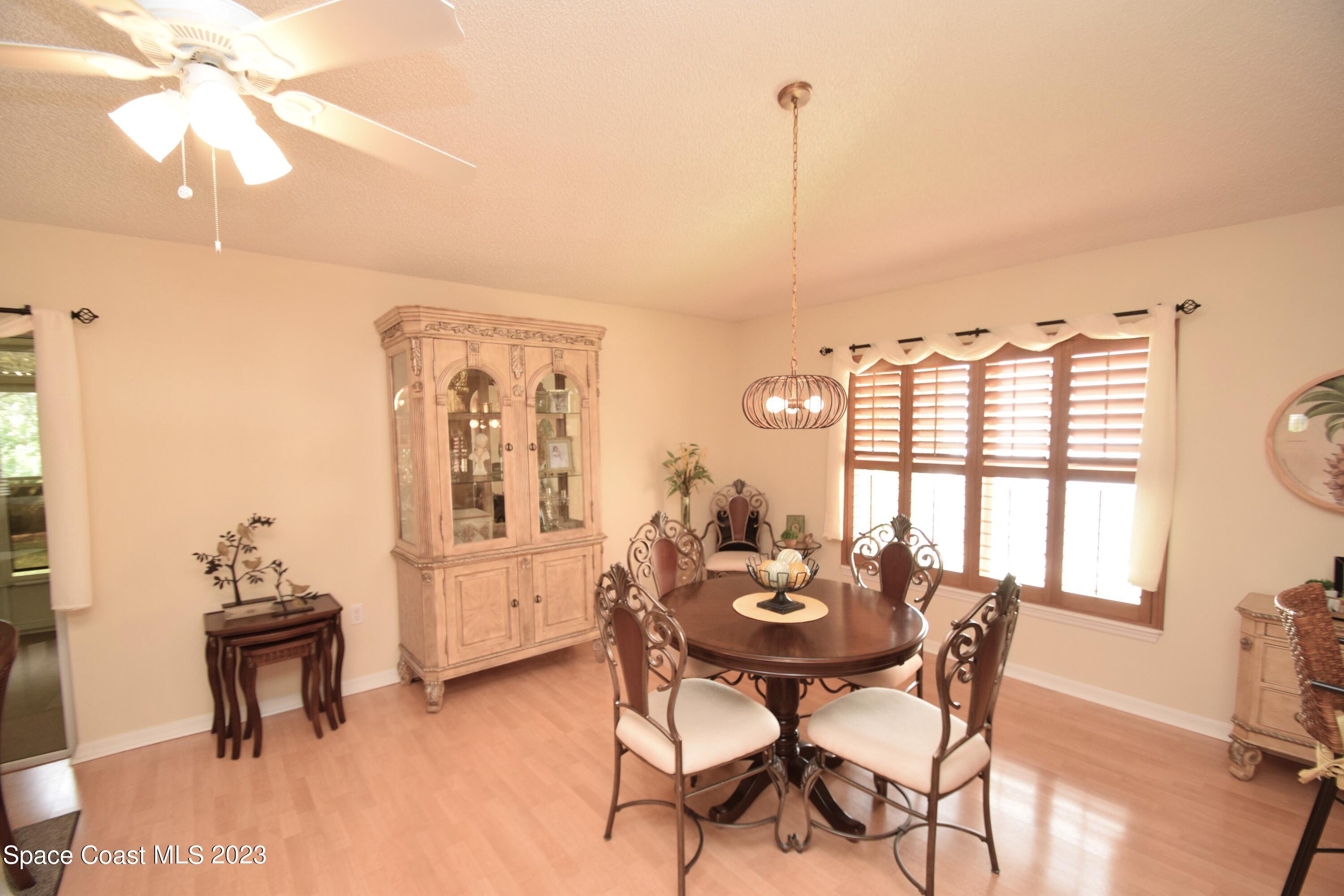 2190 Spring Creek Circle Palm Bay, FL 32905 - Photo 63 of 73 a view of a dining room with furniture and window