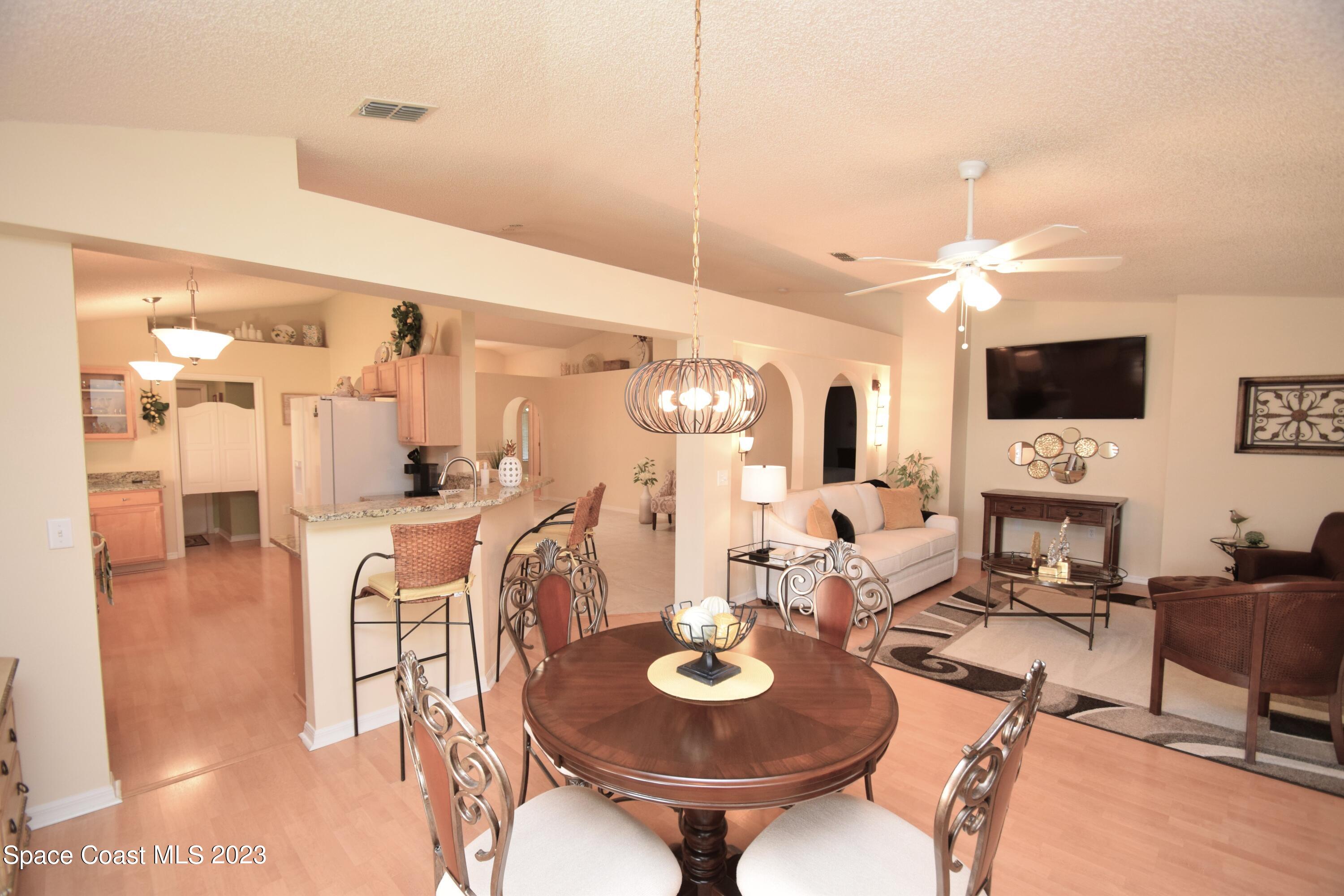 2190 Spring Creek Circle Palm Bay, FL 32905 - Photo 65 of 73 a view of a dining room with furniture