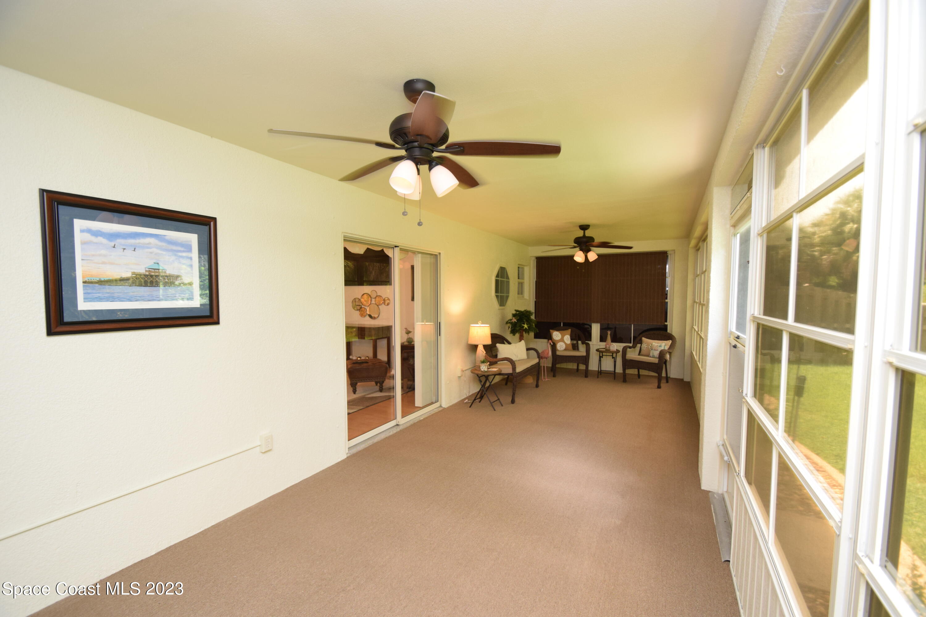2190 Spring Creek Circle Palm Bay, FL 32905 - Photo 70 of 73 a view of a livingroom with furniture and a window