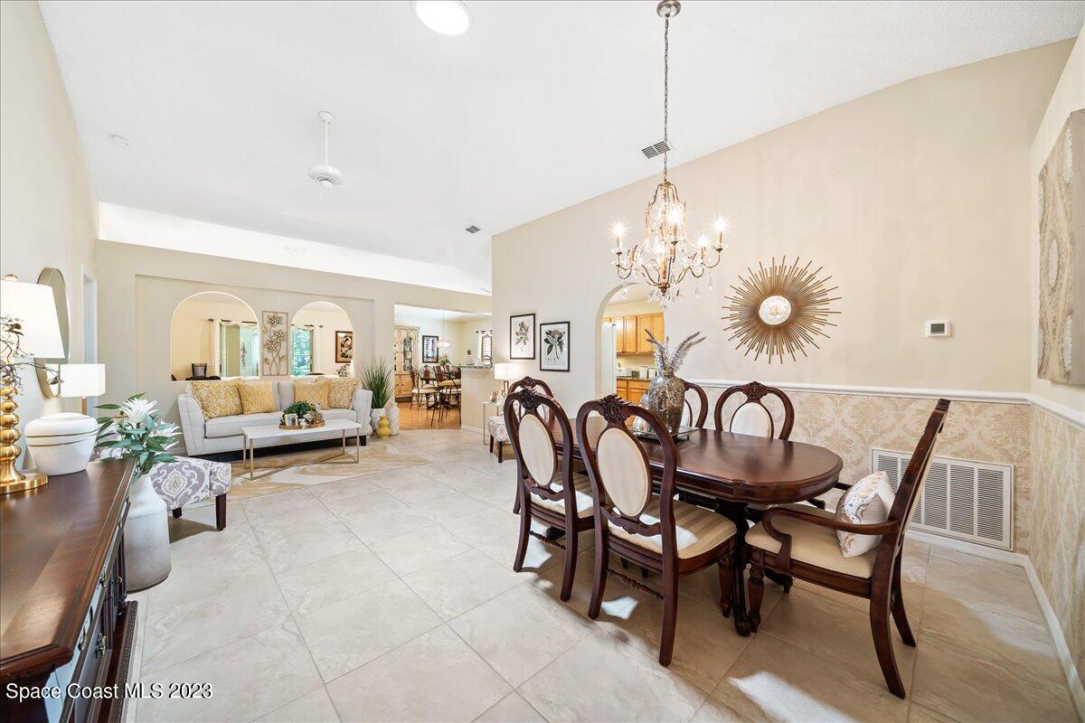 2190 Spring Creek Circle Palm Bay, FL 32905 - Photo 10 of 73 a dining room with furniture and window