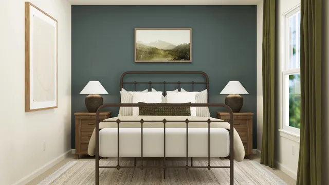 a bed sitting in a bedroom next to a window