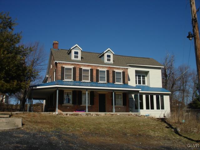 124 Longley Road Nazareth, PA 18064 - Photo 1 of 20 a front view of a house with a yard