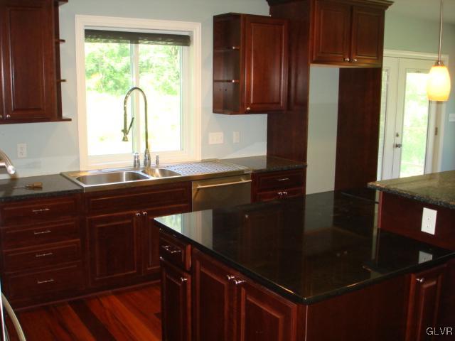124 Longley Road Nazareth, PA 18064 - Photo 8 of 20 a kitchen with a sink a counter top space and cabinets
