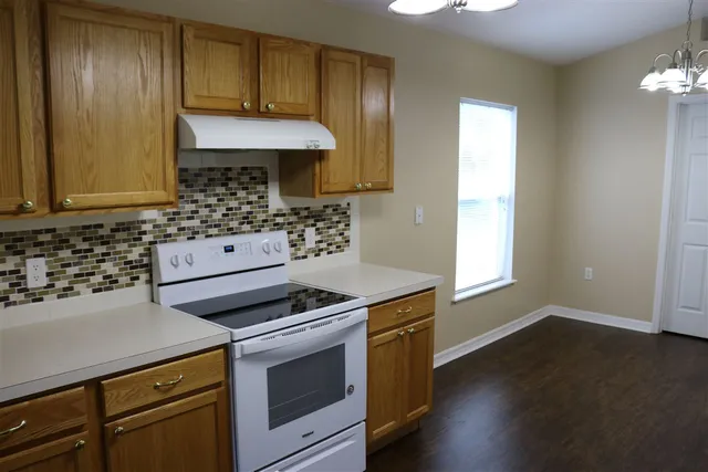 a kitchen with a stove and a microwave