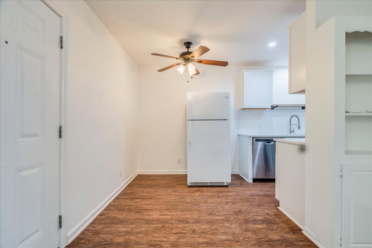 1417 Braes Ridge Drive, Unit B Austin, TX 78723 - Photo 13 of 22 a view of a kitchen with a sink and a refrigerator