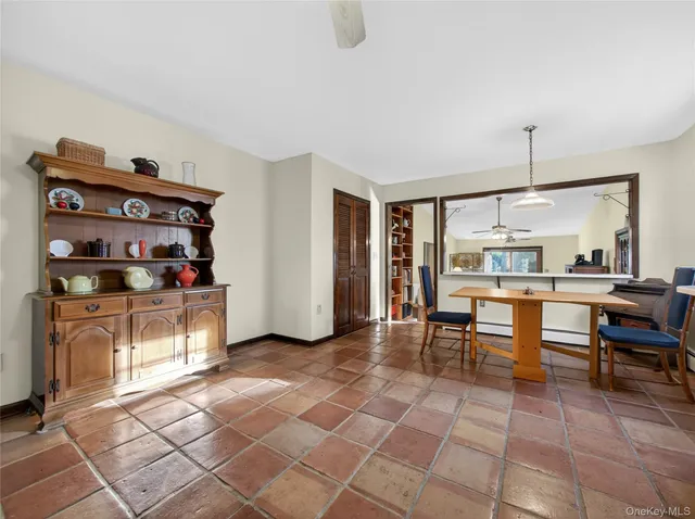 a living room with furniture a dining table and a stove top oven