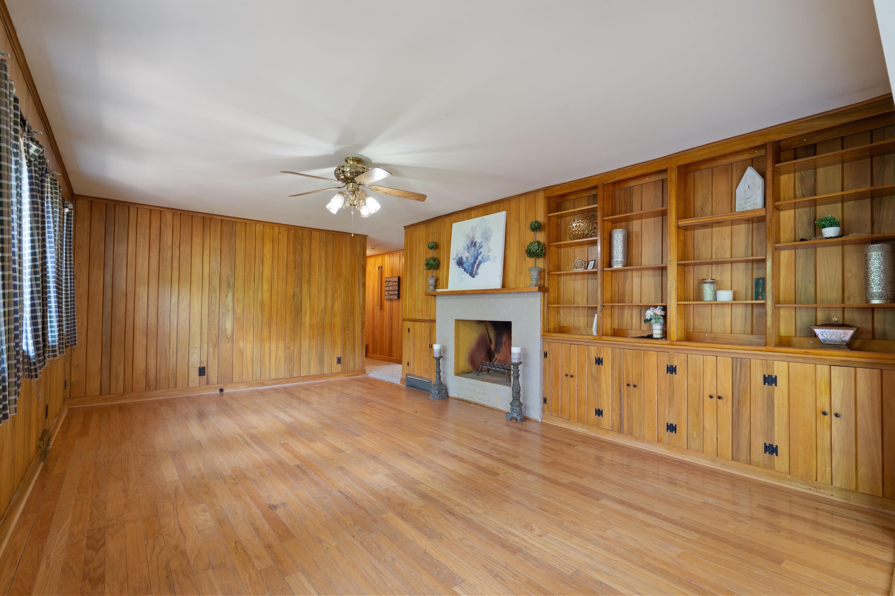6164 Elmore Road Bartlett, TN 38134 - Photo 8 of 25 a view of an empty room with a window and a fireplace