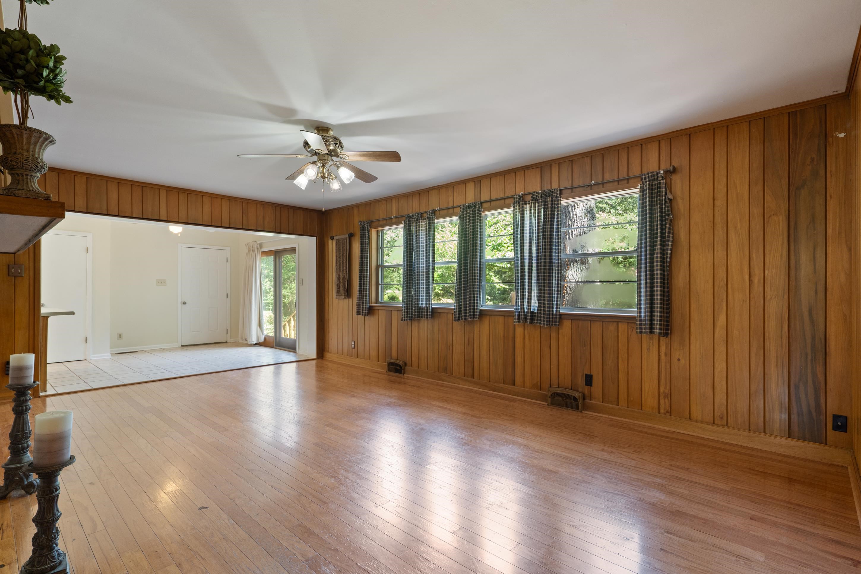 6164 Elmore Road Bartlett, TN 38134 - Photo 9 of 25 an empty room with wooden floor and windows