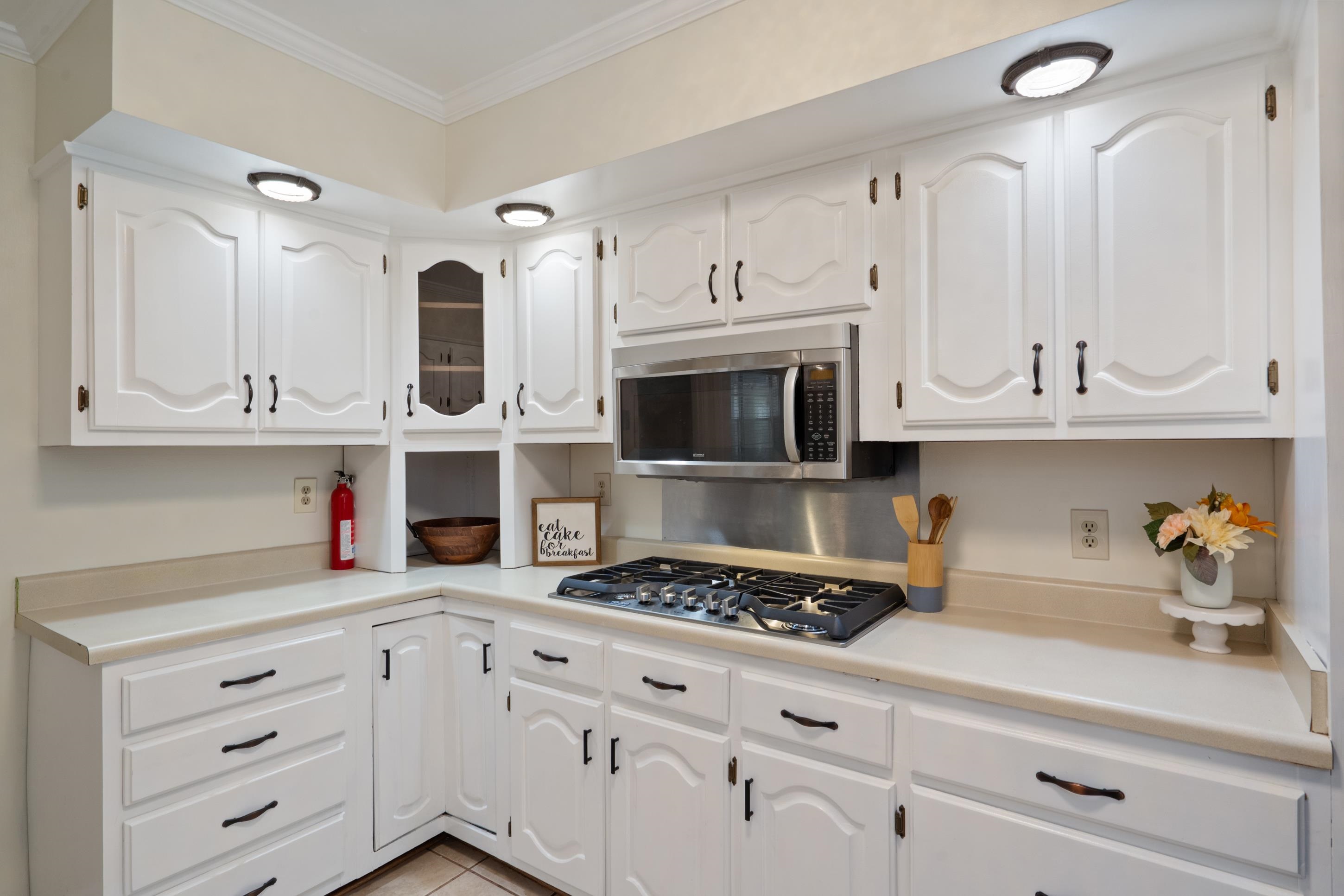 6164 Elmore Road Bartlett, TN 38134 - Photo 10 of 25 a kitchen with cabinets appliances and a counter space
