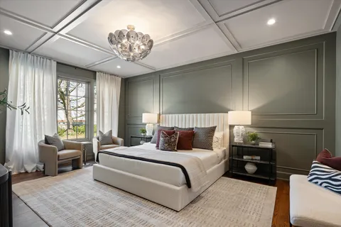 a large kitchen with a table and chairs in it