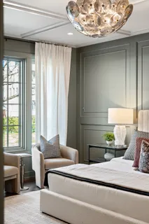 a living room with furniture a fireplace and a potted plant