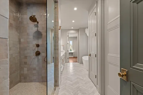 a living room with furniture a fireplace and a potted plant