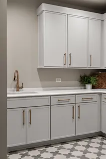 a bathroom with a toilet a sink a mirror a bathtub and vanity