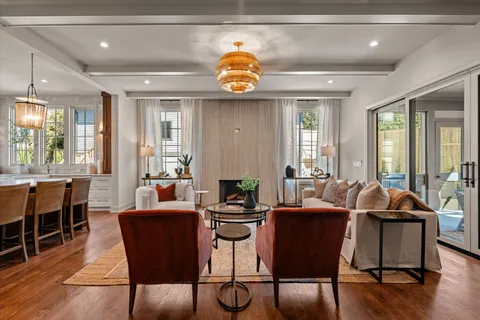 a front view of a house with a garden and sitting area