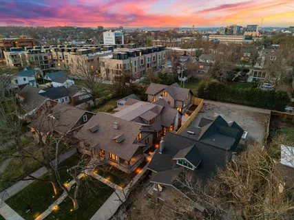 an aerial view of a house with a lake view