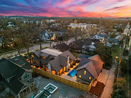 an aerial view of a house with a swimming pool