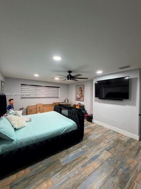 20465 Southwest 200th Street Miami, FL 33187 - Photo 22 of 36 a bedroom with a bed and a flat screen tv