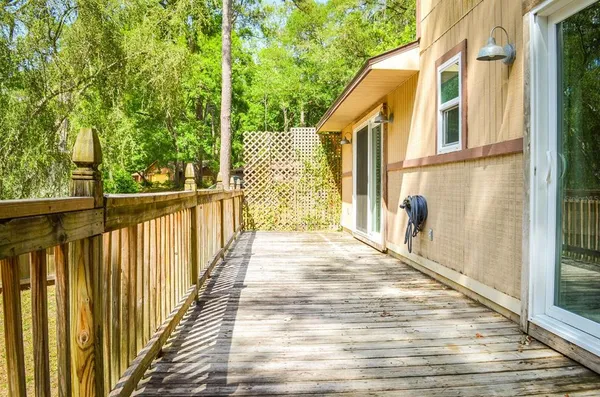 a view of a pathway of a house with a balcony