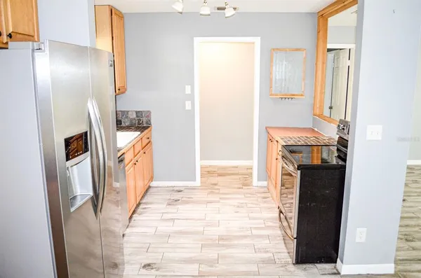 a view of a kitchen from the hallway