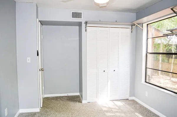 a view of an empty room with a window