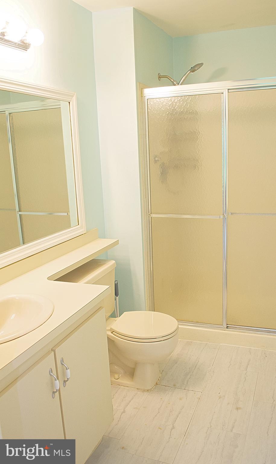 84 Willow Court Hamilton, NJ 08619 - Photo 15 of 18 a bathroom with a shower a toilet and a sink