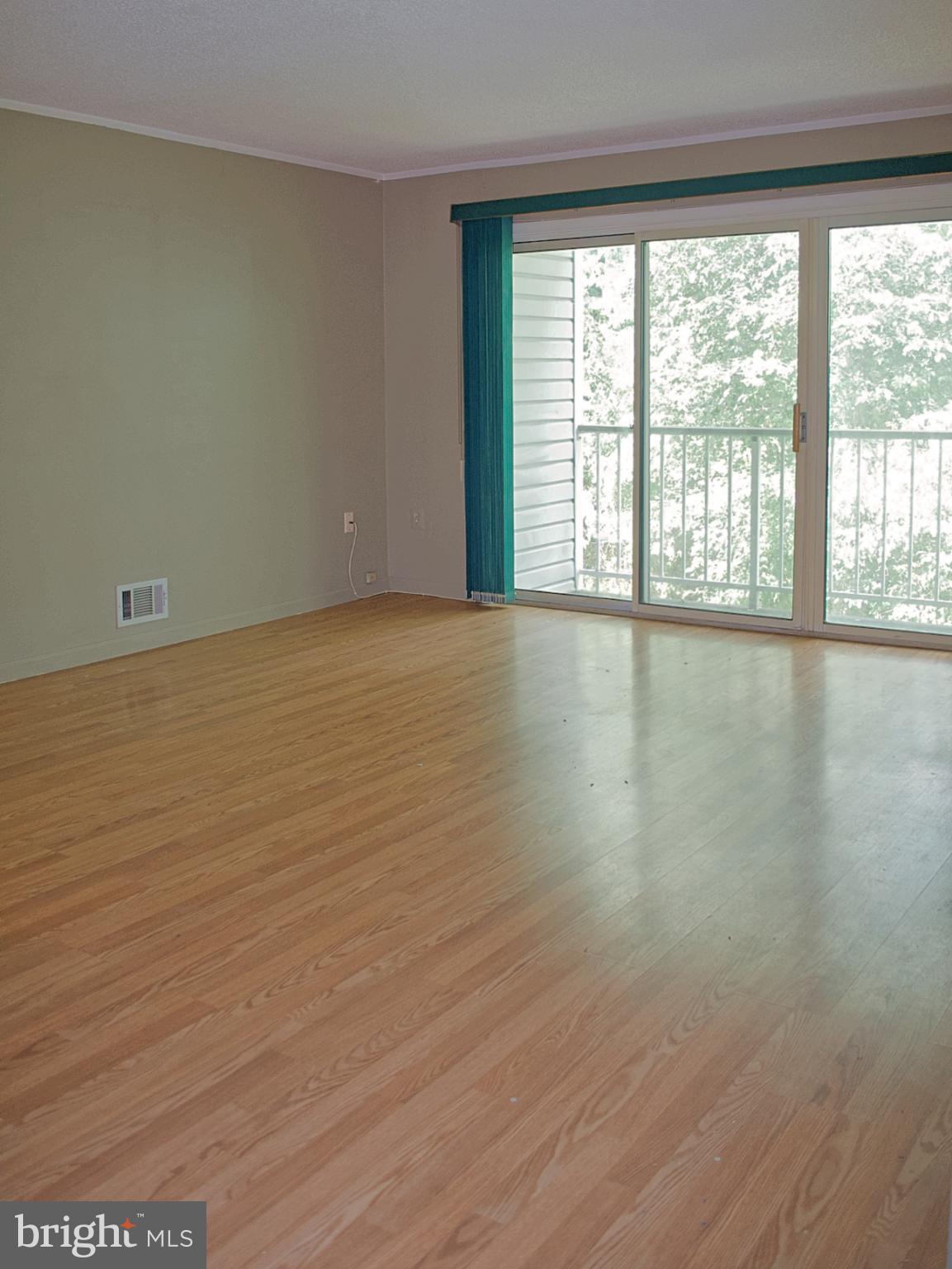 84 Willow Court Hamilton, NJ 08619 - Photo 2 of 18 wooden floor in an empty room with a window