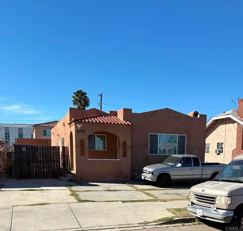 a front view of a house with parking space