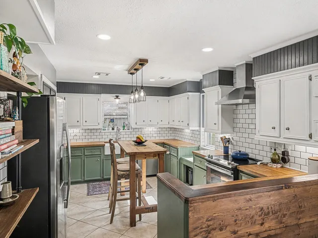 a kitchen with lots of counter top space and cabinets