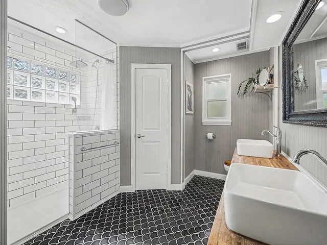 a bathroom with a sink and a shower
