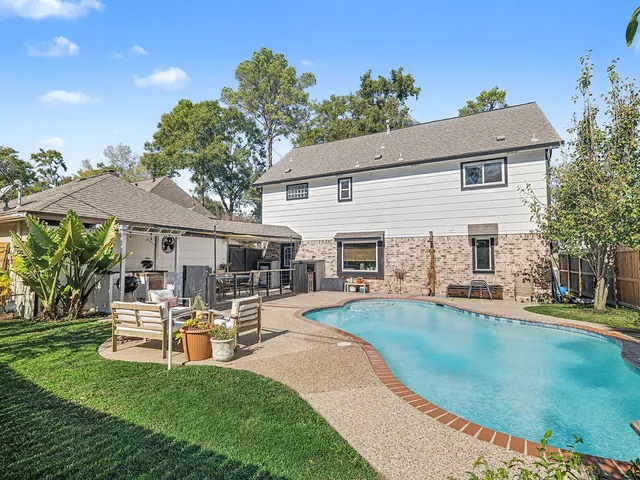 a sign board with a building in the background