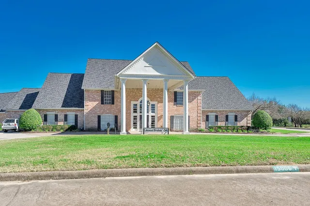 a view of a swimming pool and an outdoor space