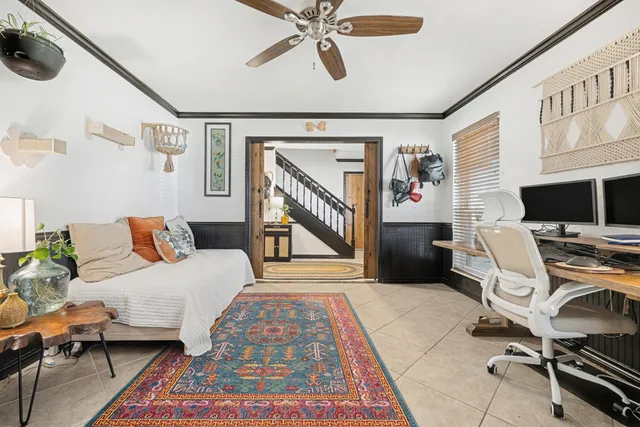 a bedroom with furniture and a window