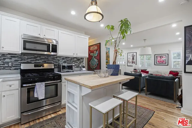 a kitchen with a stove and a microwave