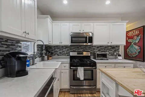 a kitchen with a stove and a microwave