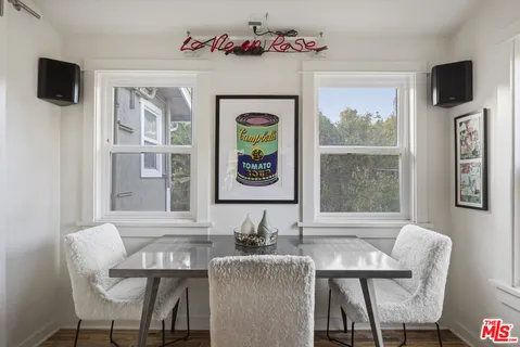 a view of a dining room with furniture window and wooden floor