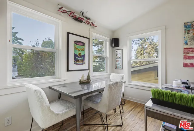 a view of a dining room with furniture window and outside view