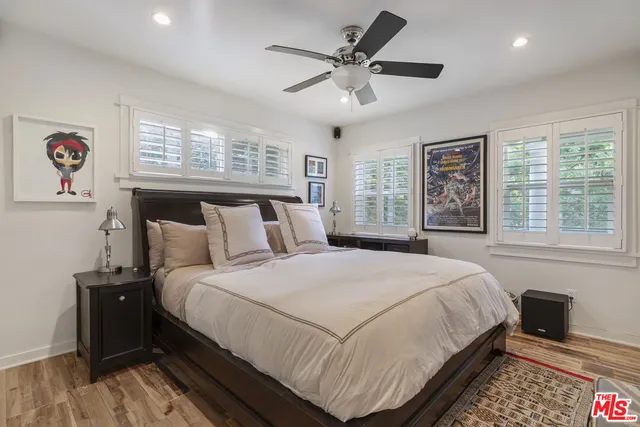 a bedroom with a large bed and a window