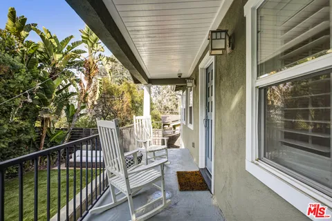 a view of balcony with furniture