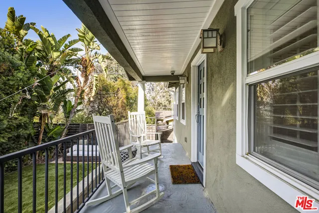 a view of balcony with furniture
