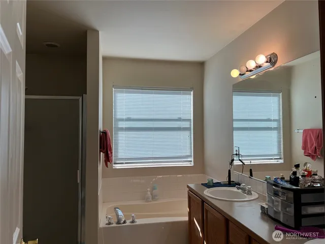 a bathroom with a bathtub and a sink