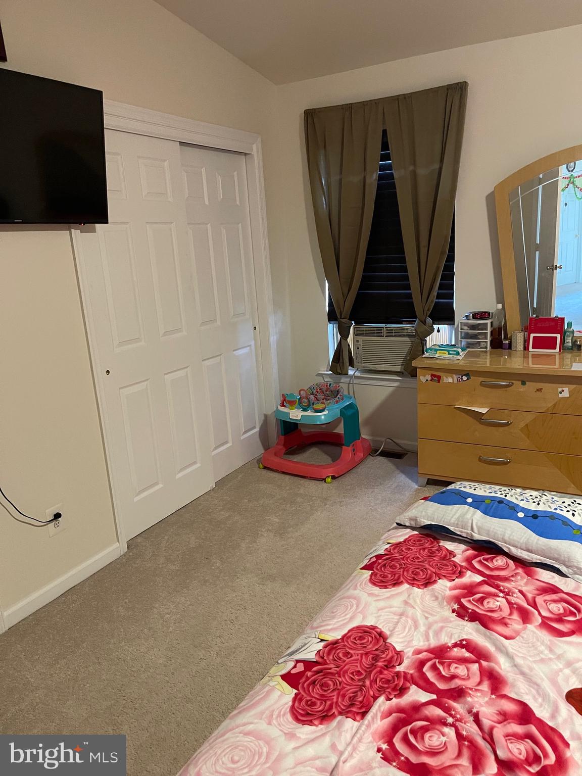 1917 Fuller Street Philadelphia, PA 19152 - Photo 4 of 8 a bedroom with a bed and a flat screen tv