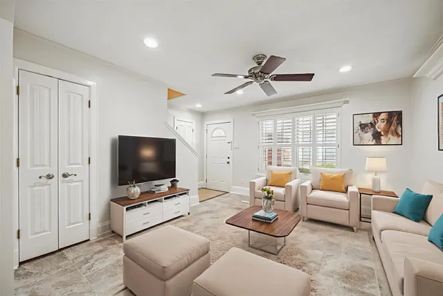 a living room with furniture and a flat screen tv