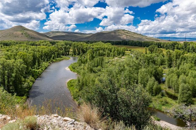 a view of a lake with a yard