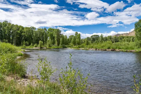 a view of a lake with a yard