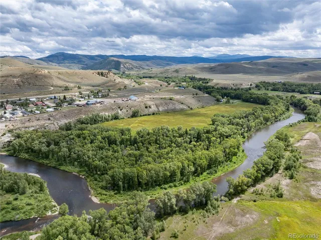a view of a yard with an outdoor seating